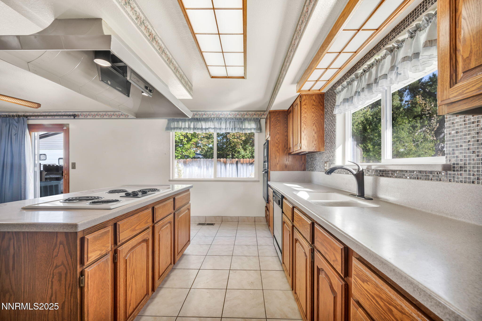 3370 Shawnee Circle Reno, NV 89502 - Photo 18 of 78 a kitchen with stainless steel appliances granite countertop a sink stove and cabinets