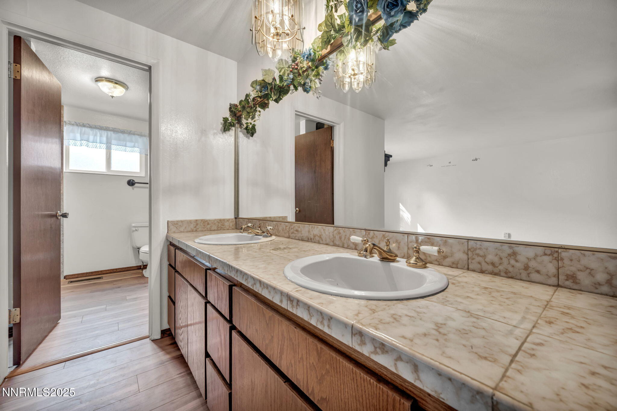 3370 Shawnee Circle Reno, NV 89502 - Photo 21 of 78 a bathroom with a granite countertop sink a large mirror and a shower