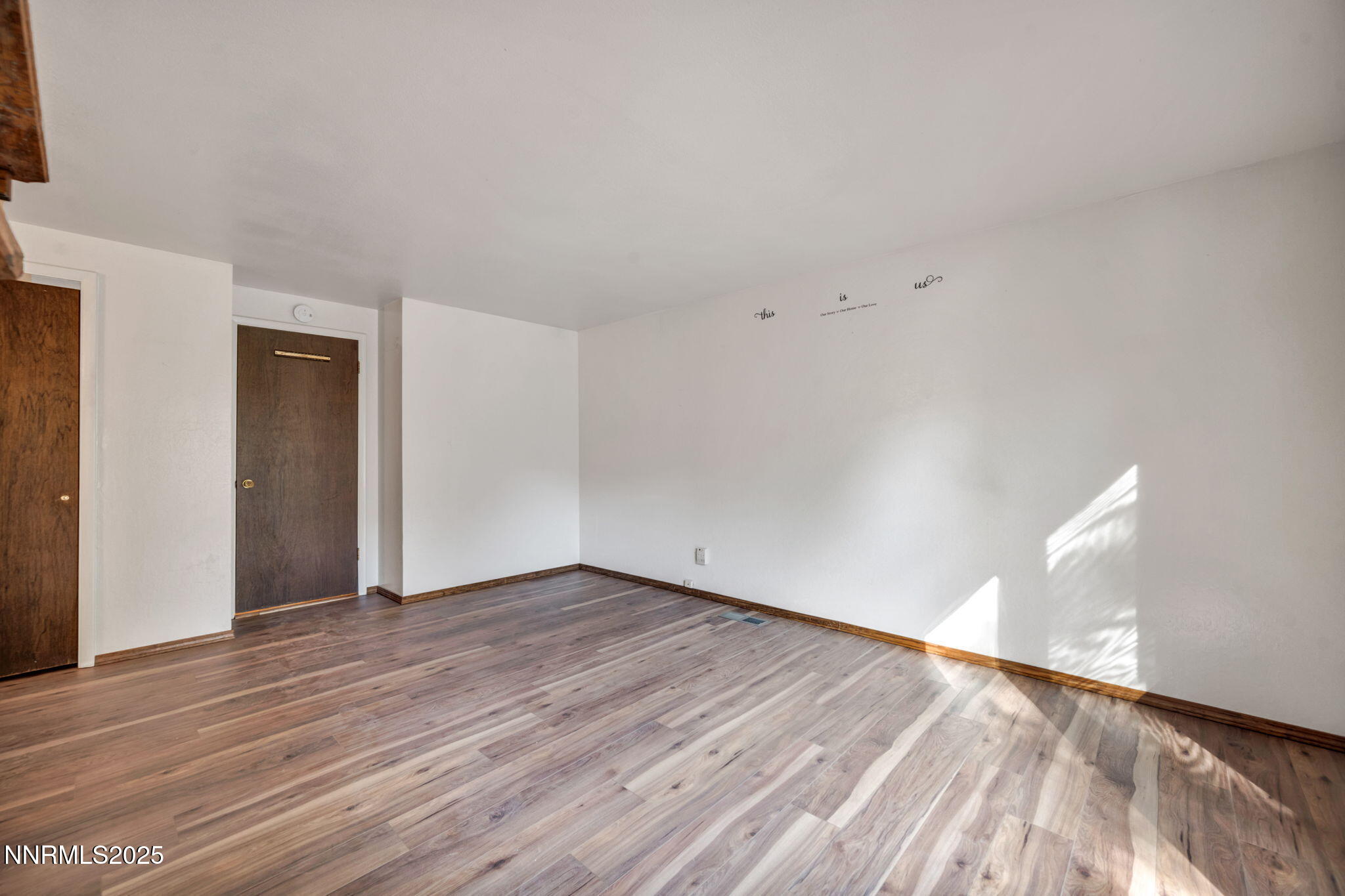 3370 Shawnee Circle Reno, NV 89502 - Photo 22 of 78 a view of an empty room with wooden floor and a window