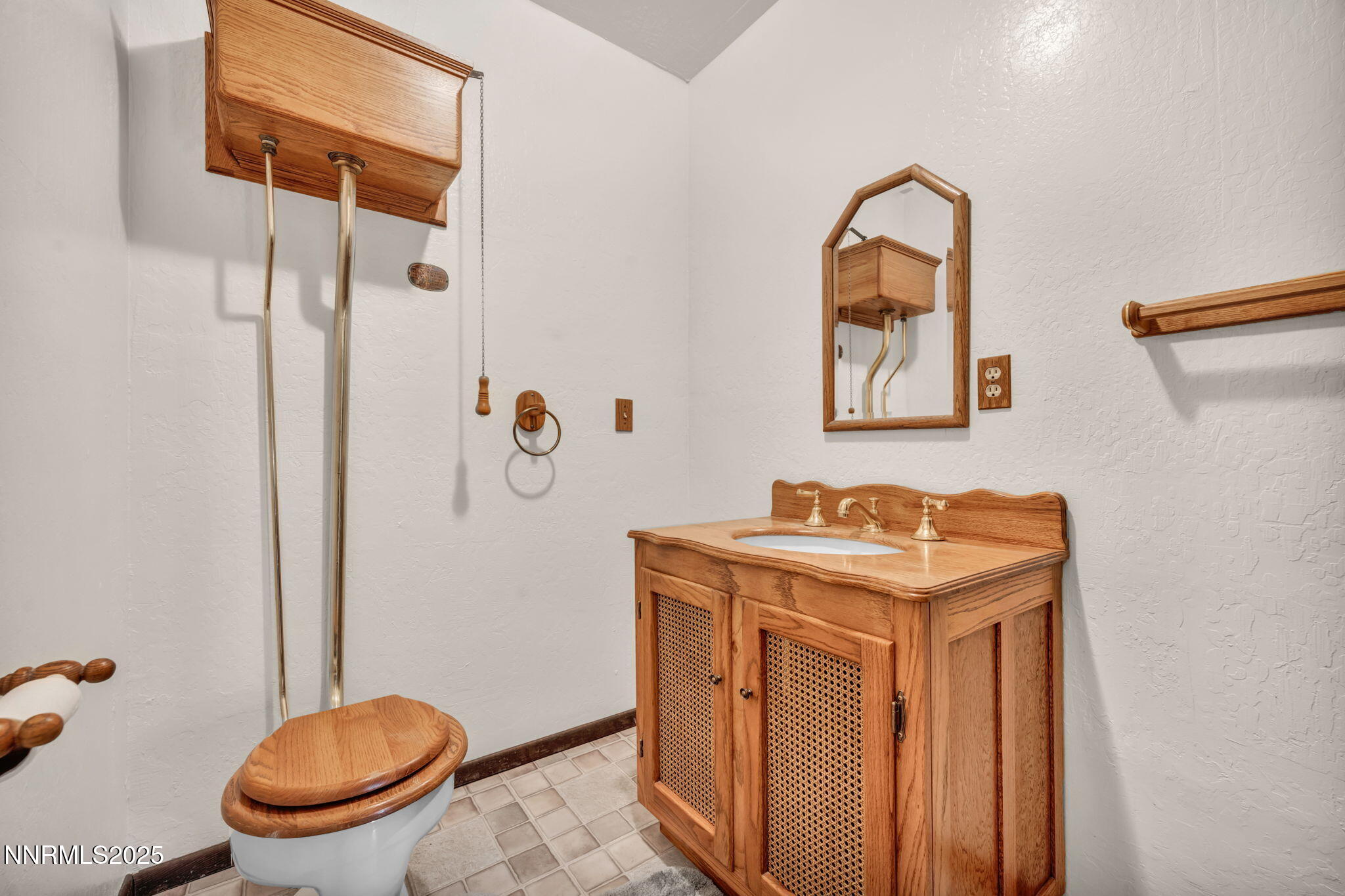 3370 Shawnee Circle Reno, NV 89502 - Photo 28 of 78 a bathroom with a granite countertop sink a toilet and a mirror