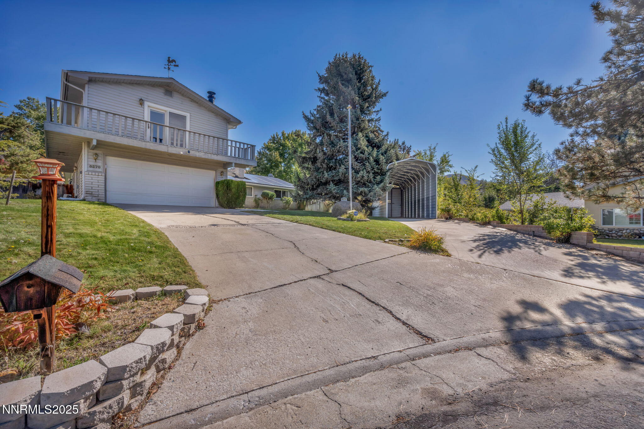 3370 Shawnee Circle Reno, NV 89502 - Photo 37 of 78 a front view of a house with a yard and garage