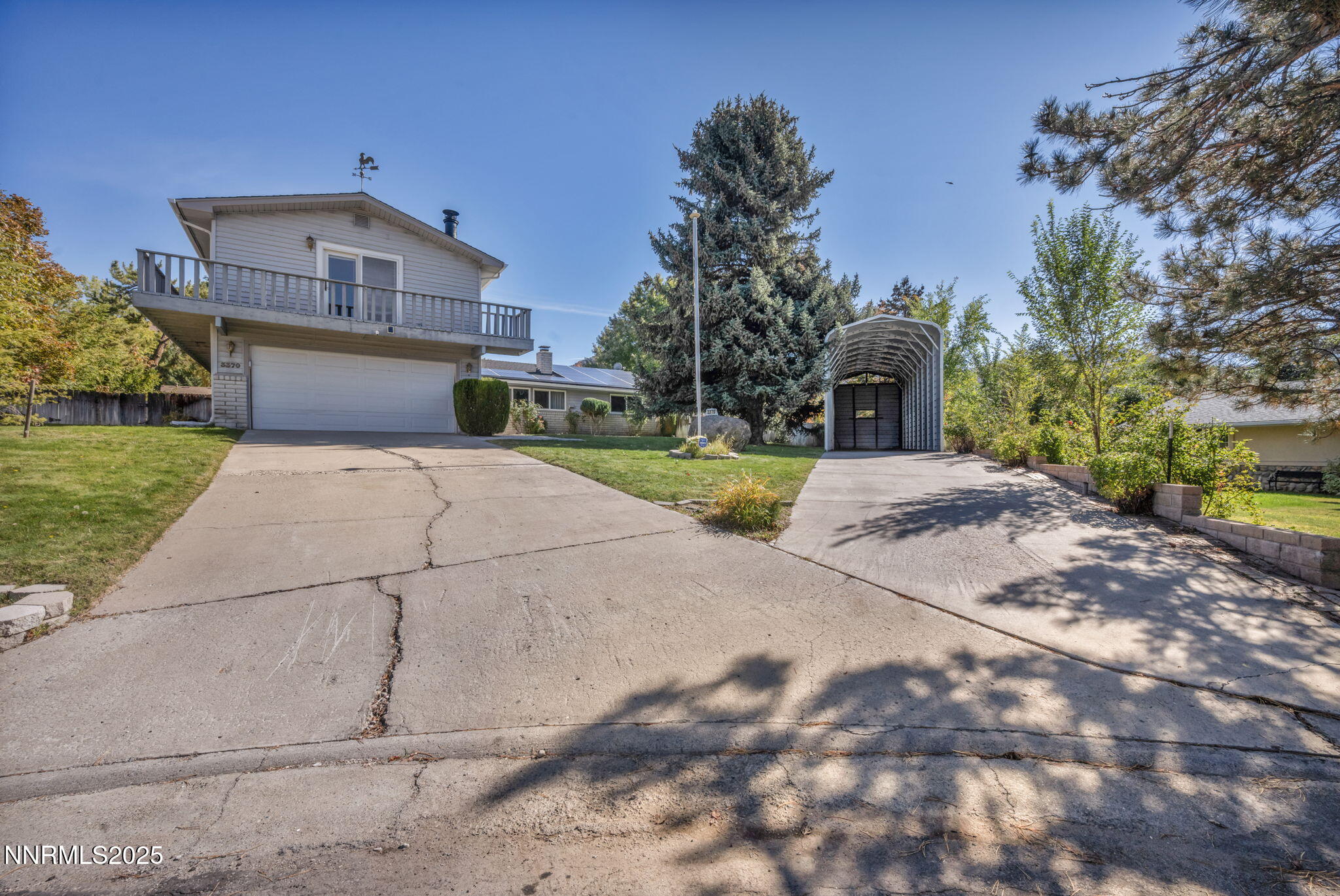 3370 Shawnee Circle Reno, NV 89502 - Photo 38 of 78 a front view of a house with a yard and garage