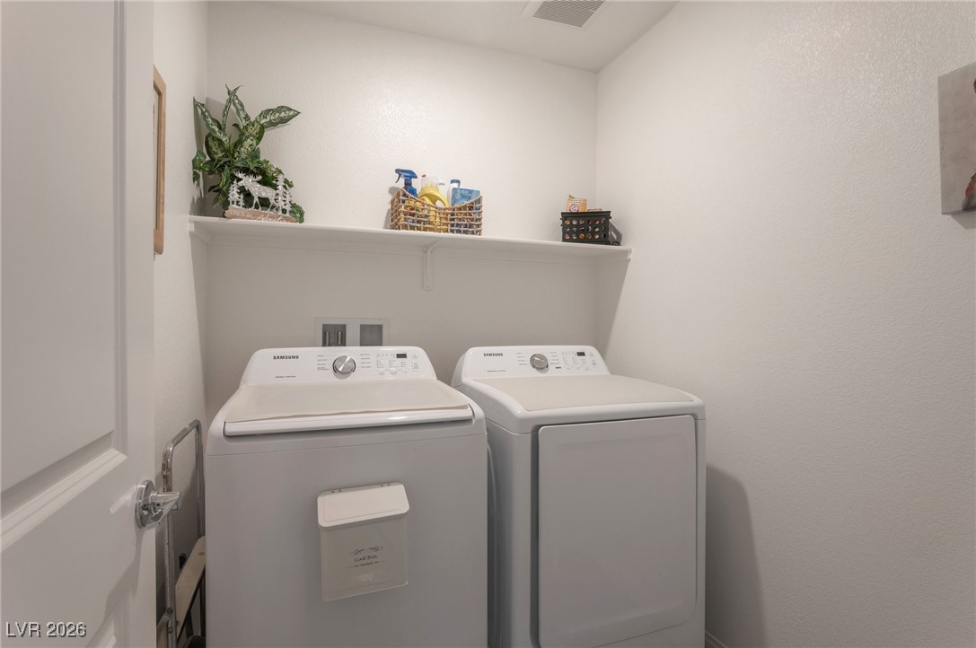 12348 Golden Wreath Road, Unit 1 Las Vegas, NV 89183 - Photo 27 of 37 Washroom featuring separate washer and dryer