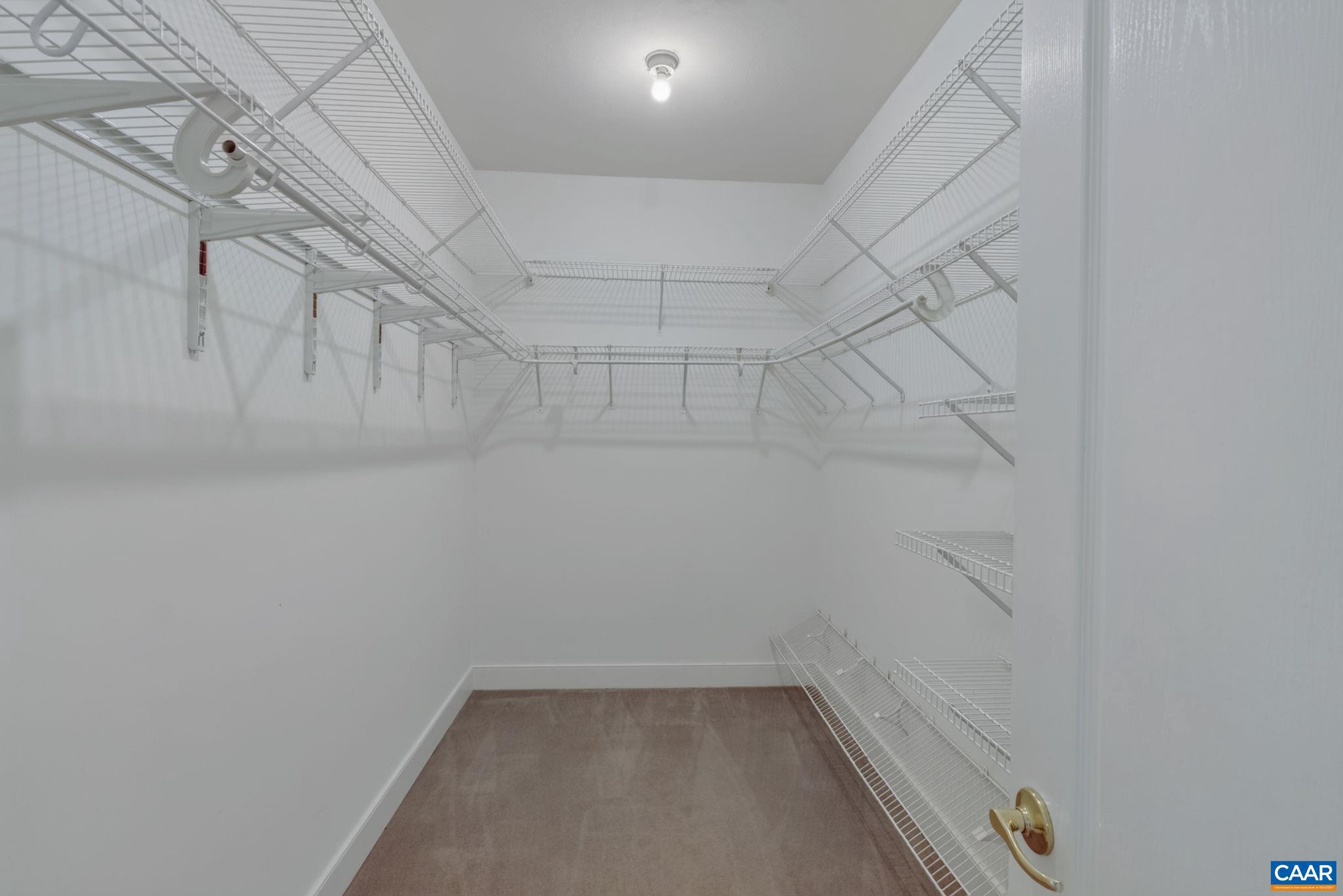 6285 Jarmans Gap Road Crozet, VA 22932 - Photo 21 of 65 a view of a room with racks on the wall