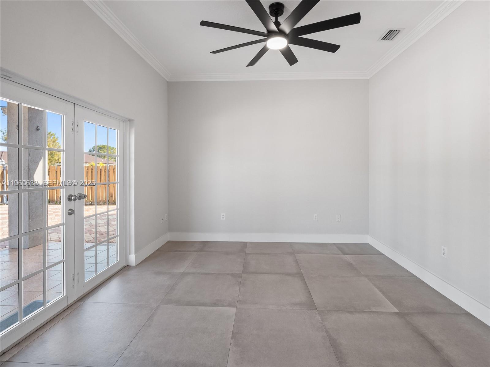 14833 Southwest 35th Lane Miami, FL 33185 - Photo 25 of 45 an empty room with windows