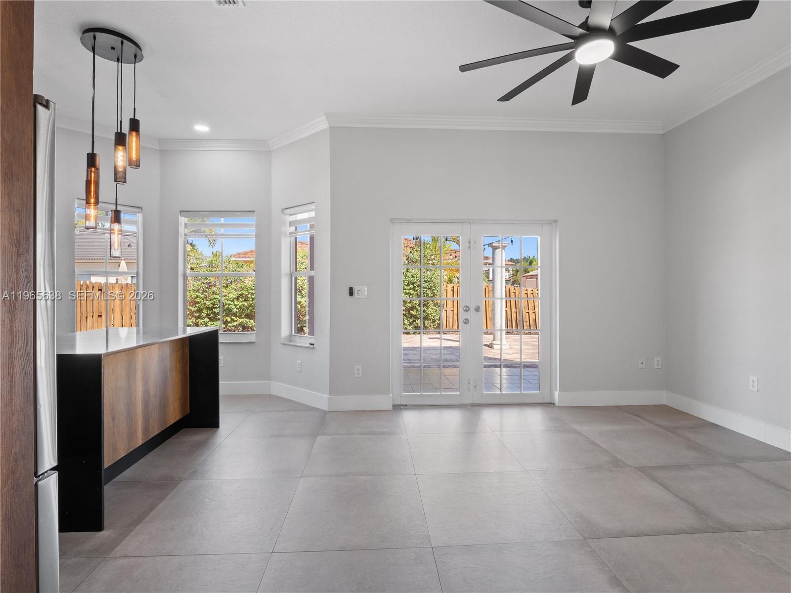 14833 Southwest 35th Lane Miami, FL 33185 - Photo 26 of 45 a view of open kitchen with a sink and wooden floor