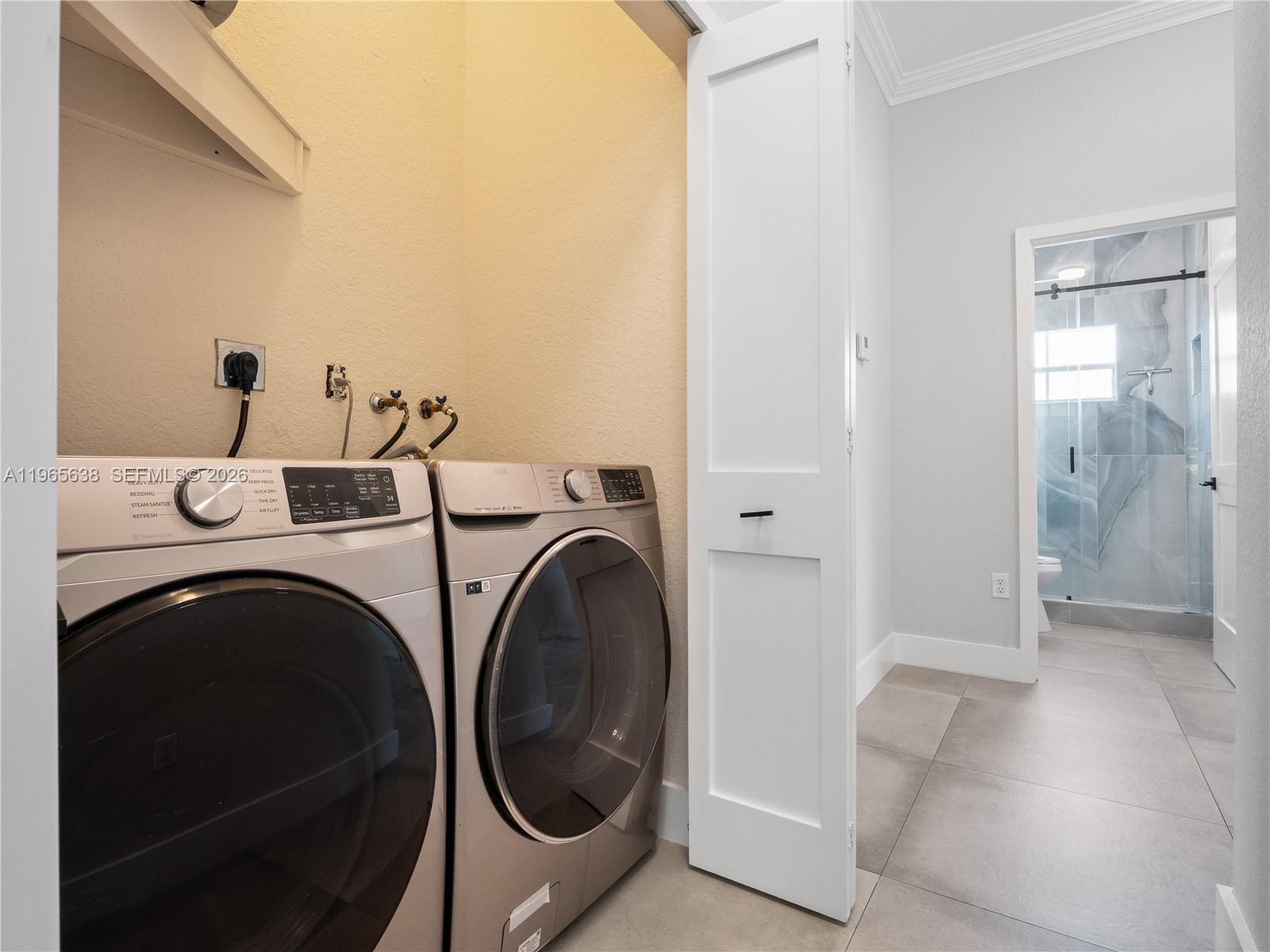 14833 Southwest 35th Lane Miami, FL 33185 - Photo 27 of 45 a utility room with dryer and washer