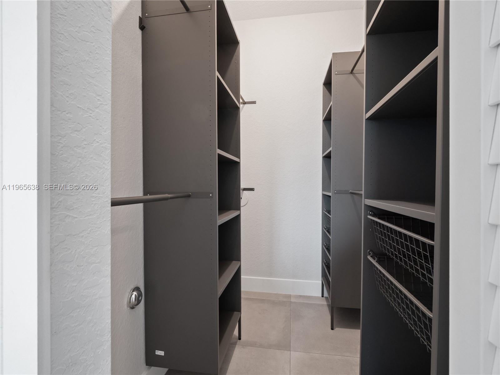14833 Southwest 35th Lane Miami, FL 33185 - Photo 30 of 45 a view of walk in closet with racks on the wall