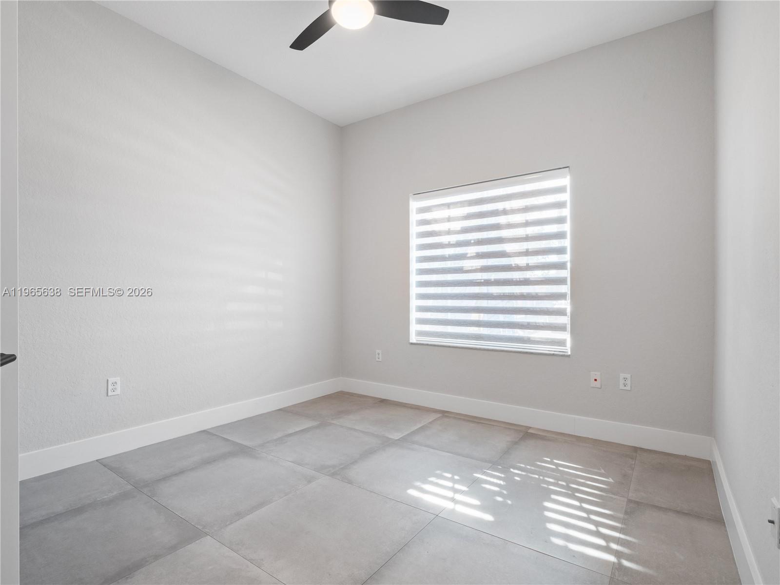 14833 Southwest 35th Lane Miami, FL 33185 - Photo 34 of 45 a view of an empty room with a window