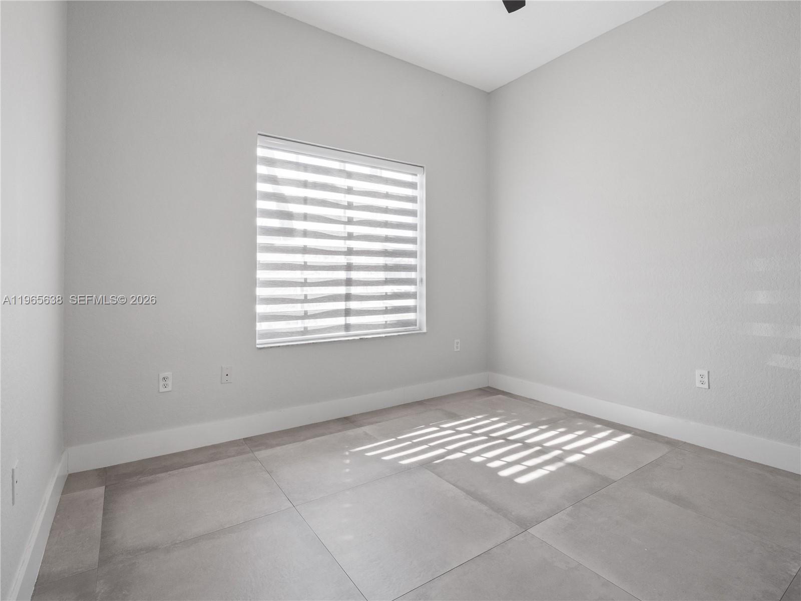 14833 Southwest 35th Lane Miami, FL 33185 - Photo 36 of 45 a view of an empty room with a window