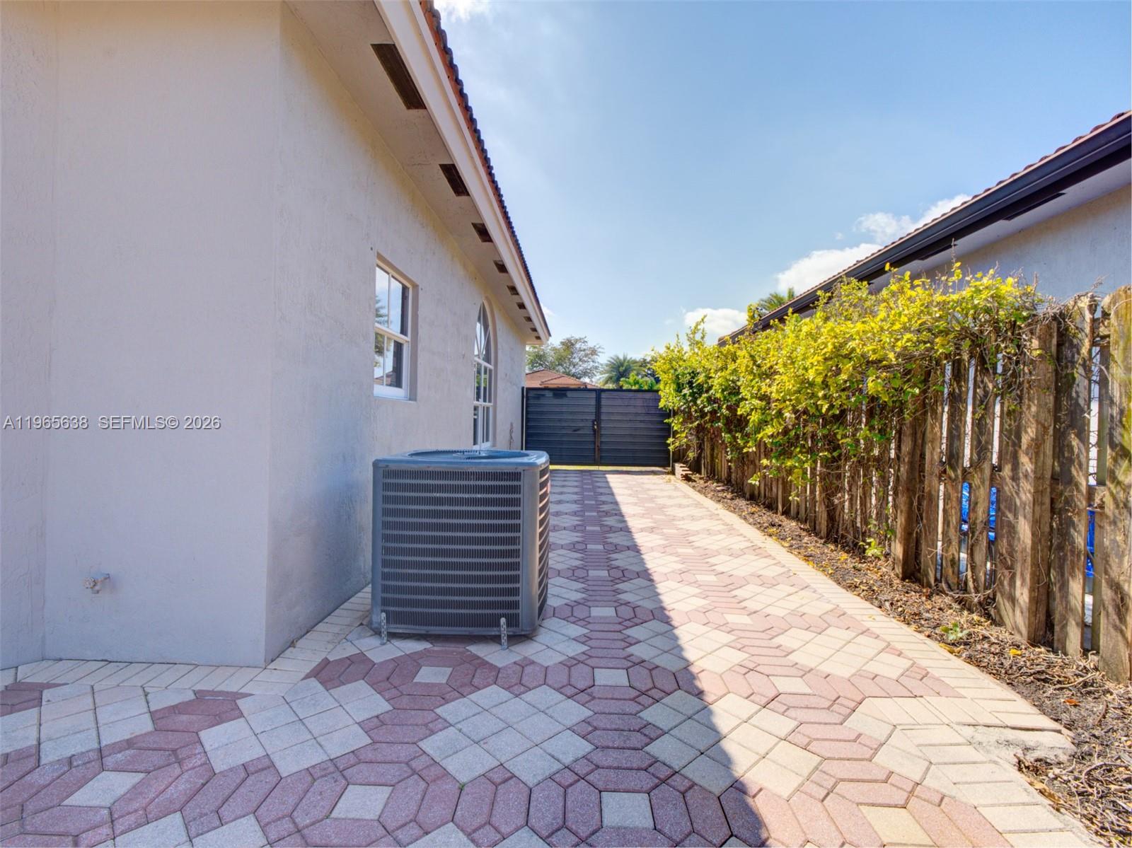 14833 Southwest 35th Lane Miami, FL 33185 - Photo 40 of 45 a view of a pathway both side of house
