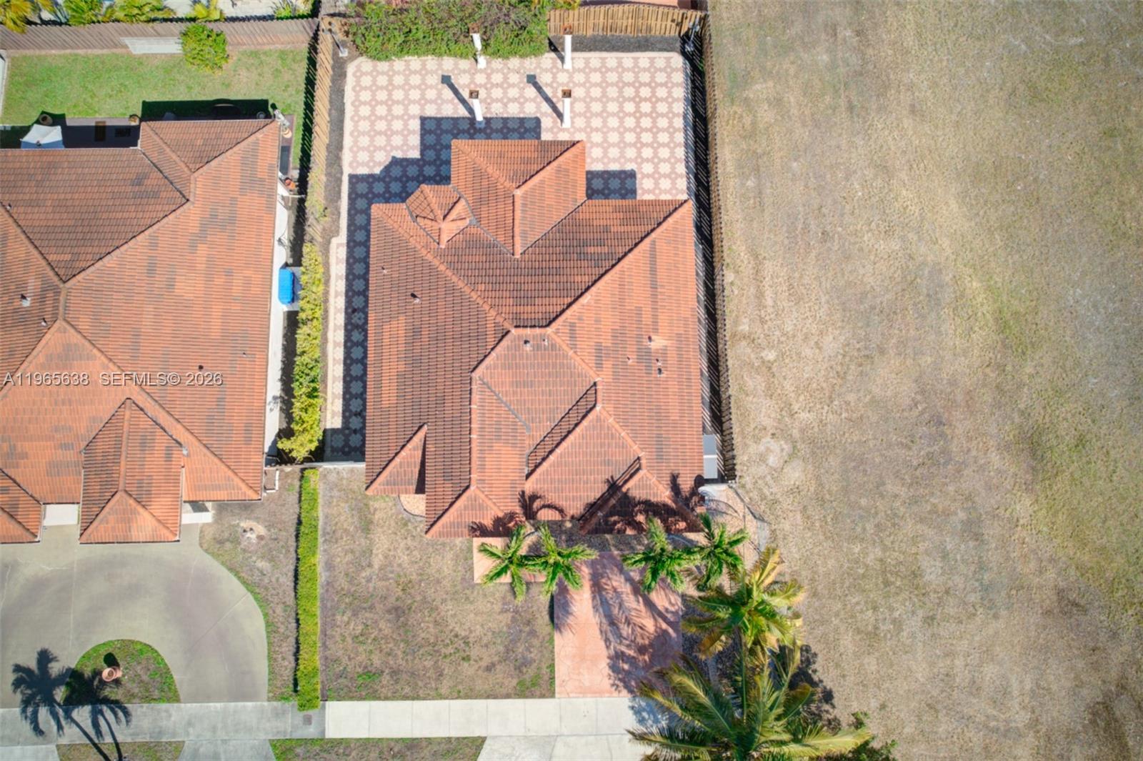 14833 Southwest 35th Lane Miami, FL 33185 - Photo 4 of 45 an aerial view of a house with a yard and a fountain