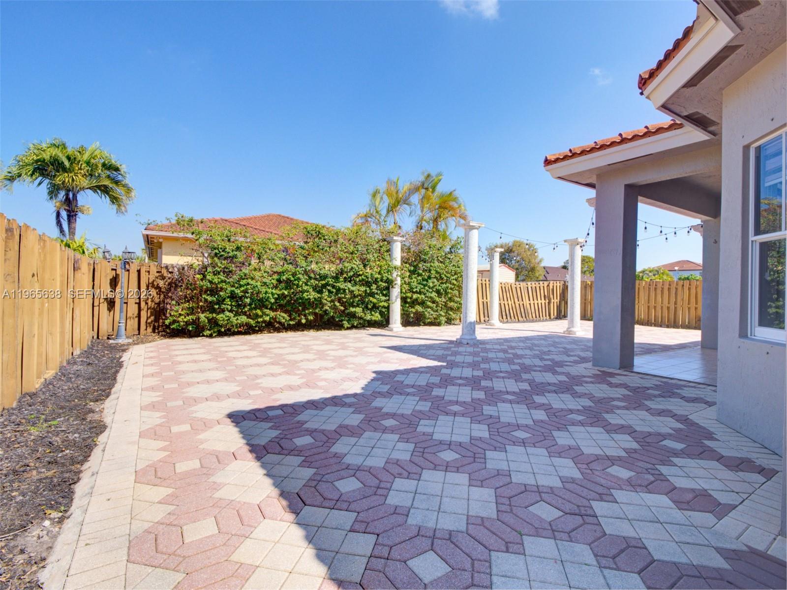 14833 Southwest 35th Lane Miami, FL 33185 - Photo 41 of 45 a view of a house with a yard and chandelier