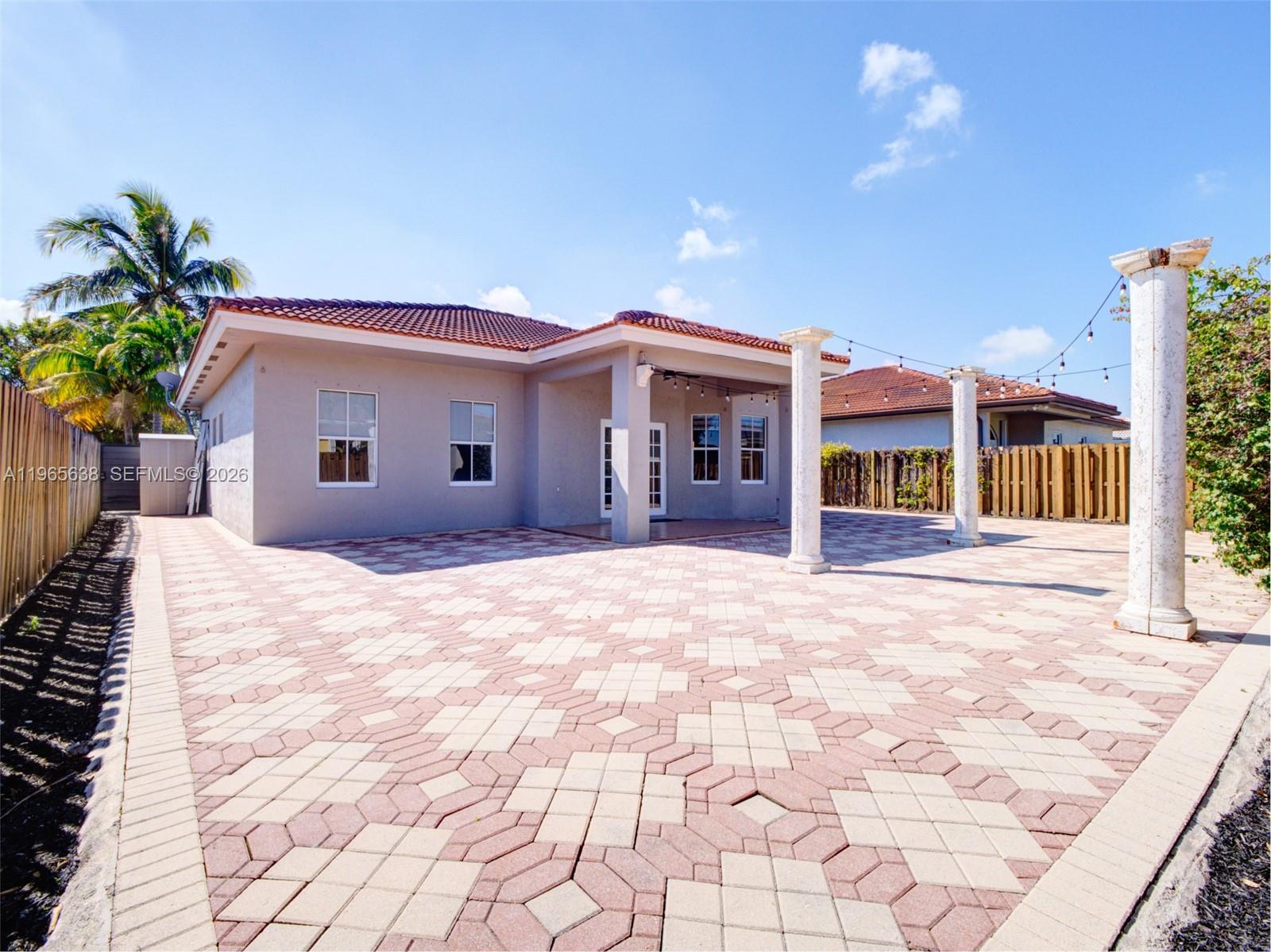14833 Southwest 35th Lane Miami, FL 33185 - Photo 44 of 45 a view of a house with a yard
