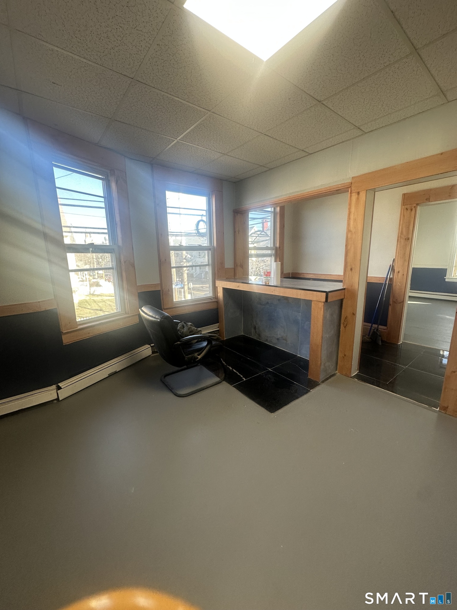 1365 East Main Street Bridgeport, CT 06608 - Photo 12 of 40 a living room with furniture a window and a fireplace