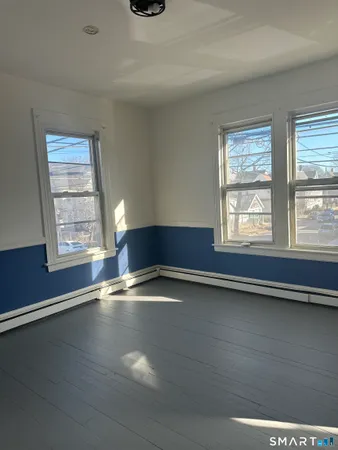 a view of an empty room with closet