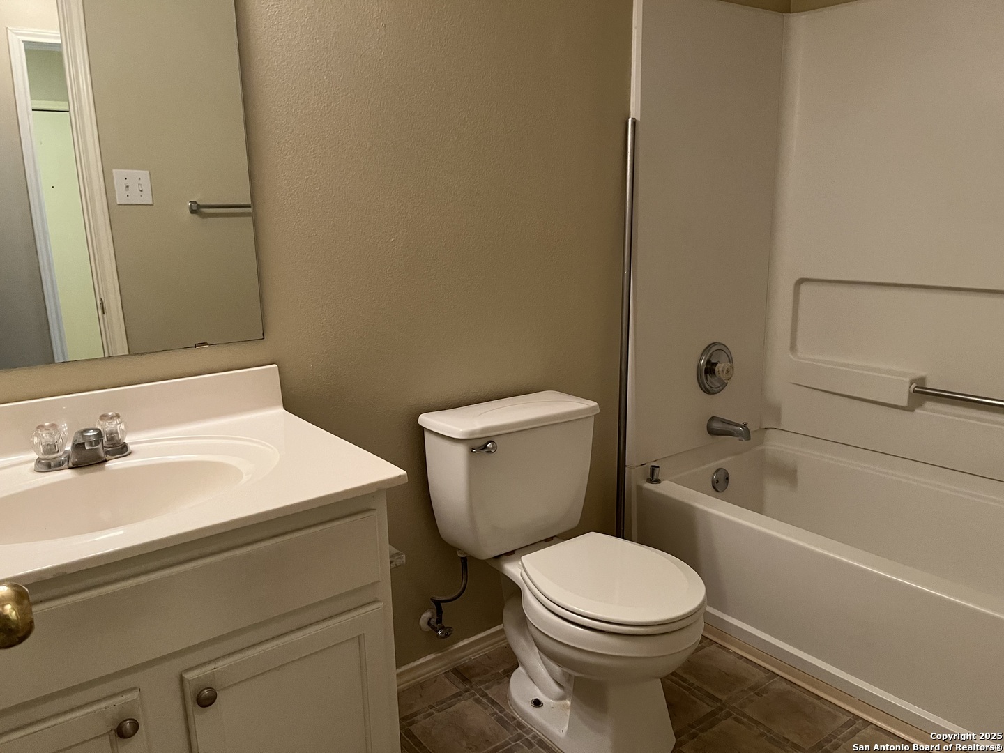 8011 Rio NIEBLA San Antonio, TX 78249 - Photo 18 of 18 a white toilet sitting next to a bathroom sink