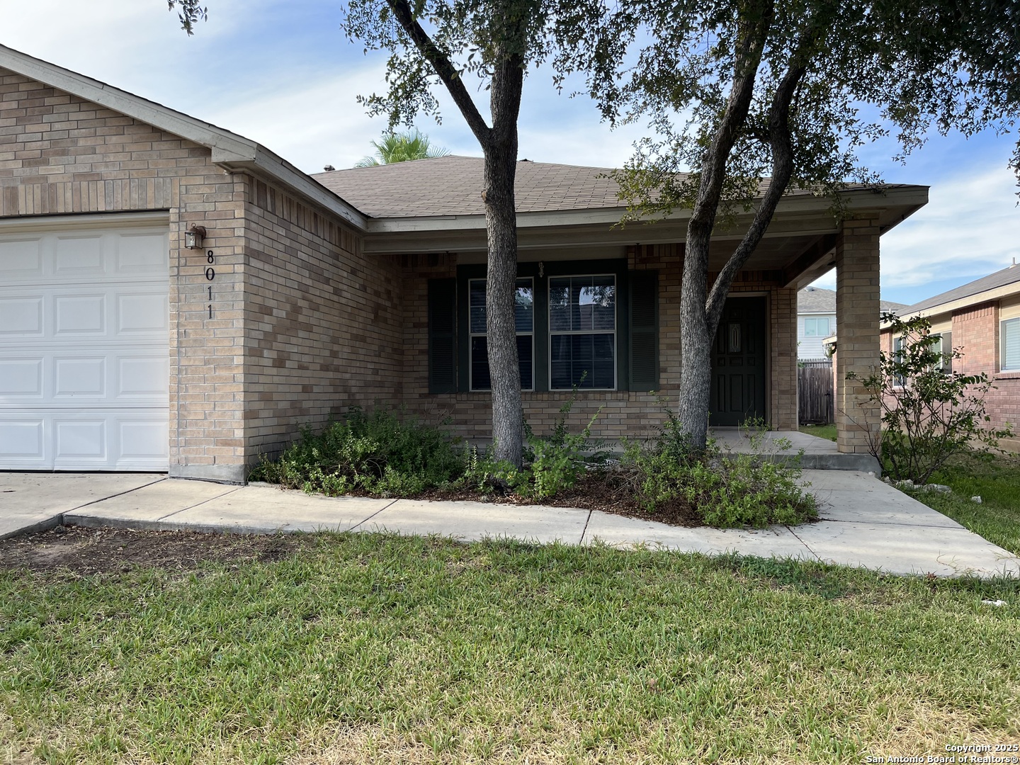 8011 Rio NIEBLA San Antonio, TX 78249 - Photo 2 of 18 a front view of a house with a yard