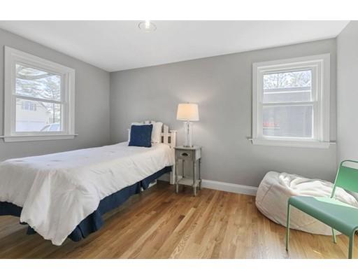 2 Abbott Road Natick, MA 01760 - Photo 17 of 23 a bedroom with a bed and wooden floor