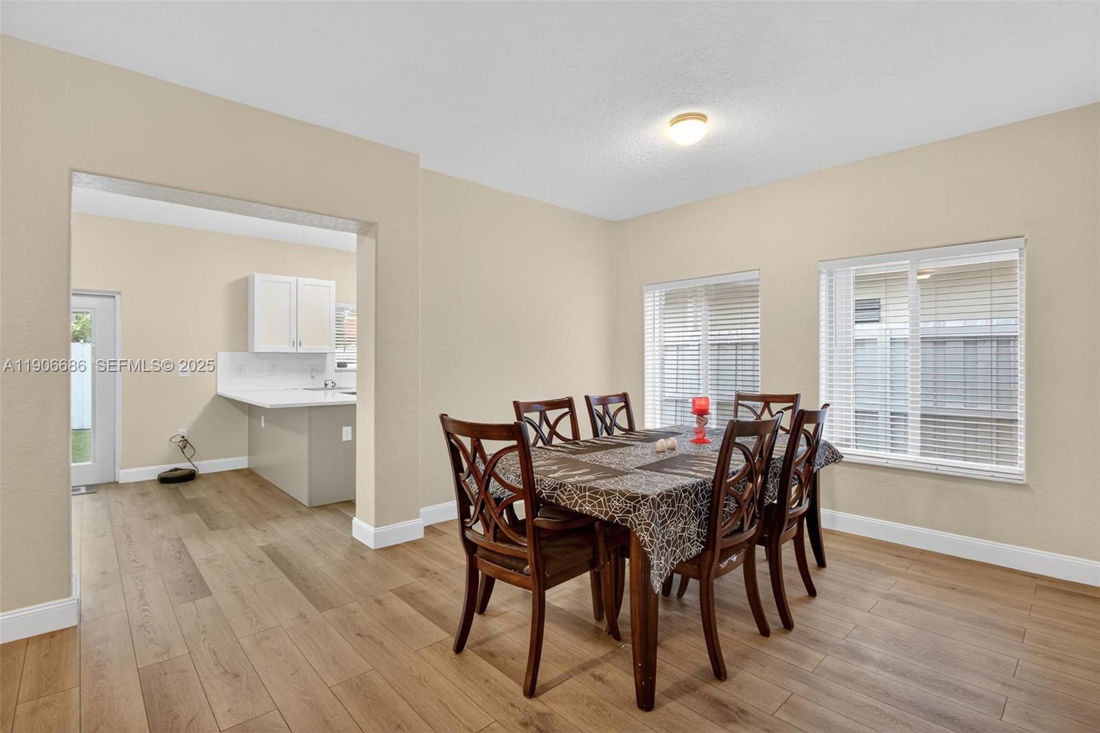 5302 Southwest 164th Place Miami, FL 33185 - Photo 11 of 43 a view of a dining room with furniture and wooden floor