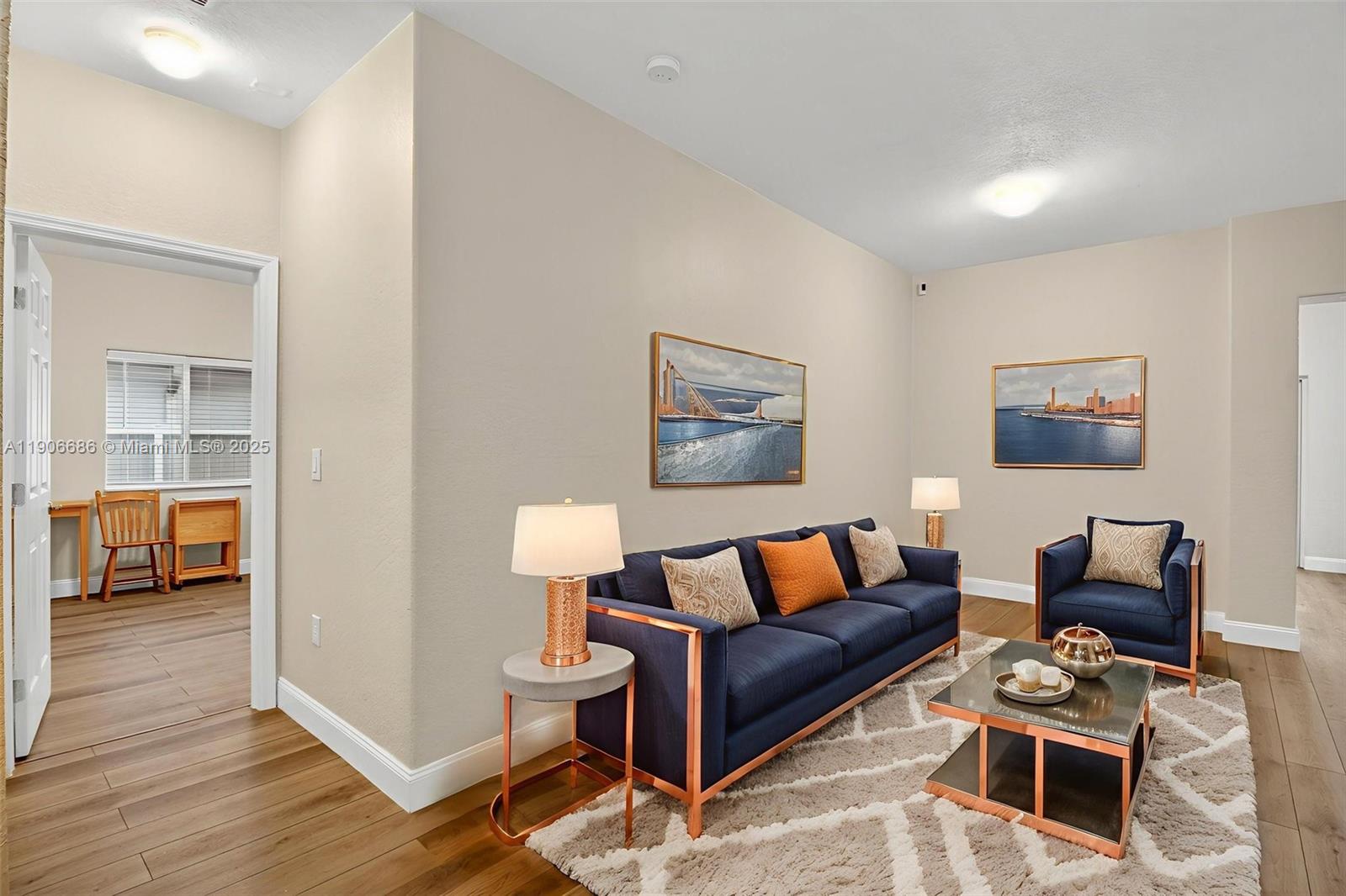 5302 Southwest 164th Place Miami, FL 33185 - Photo 17 of 43 a living room with furniture and a walk in closet with wooden floor