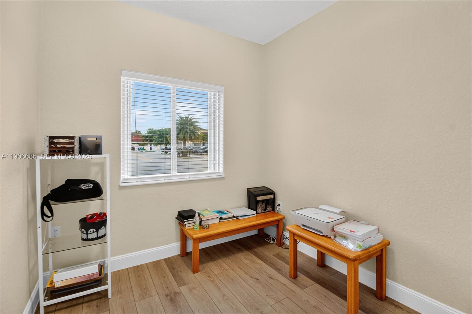5302 Southwest 164th Place Miami, FL 33185 - Photo 18 of 43 a living room with furniture and a window