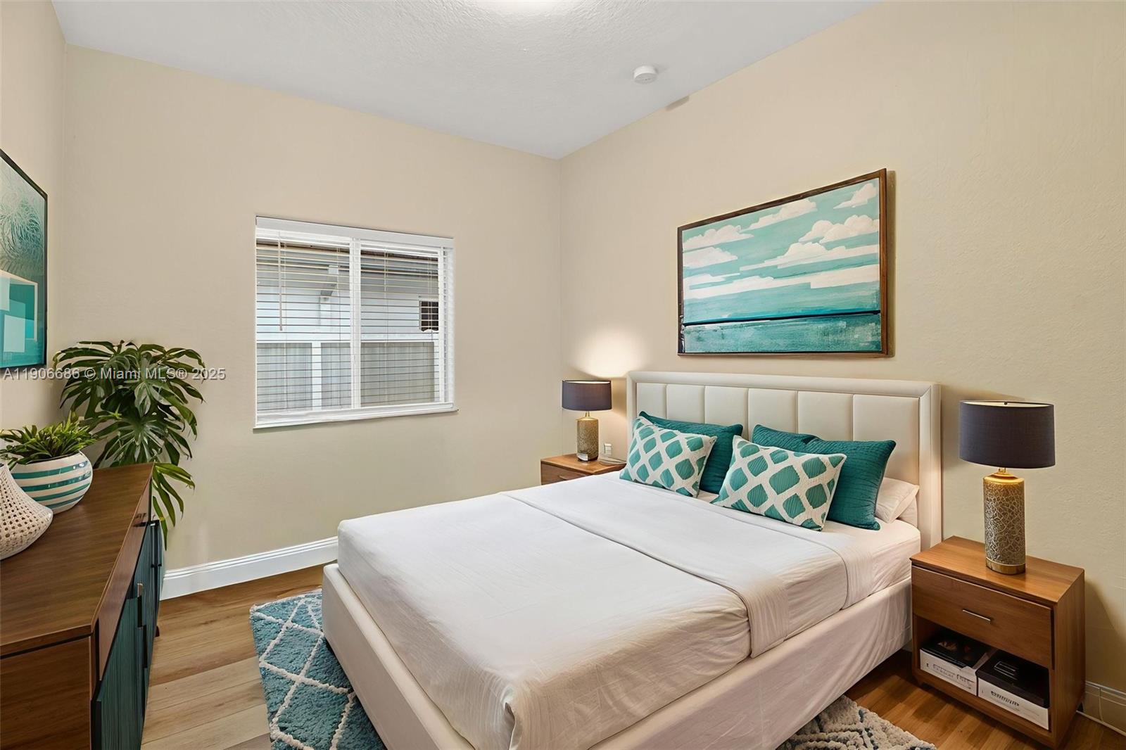 5302 Southwest 164th Place Miami, FL 33185 - Photo 24 of 43 a bedroom with bed and wooden floor