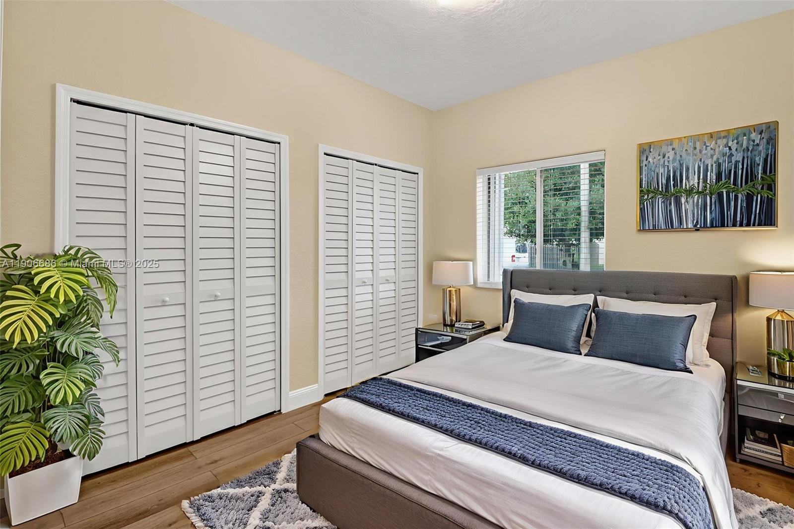 5302 Southwest 164th Place Miami, FL 33185 - Photo 27 of 43 a bedroom with a bed and a window