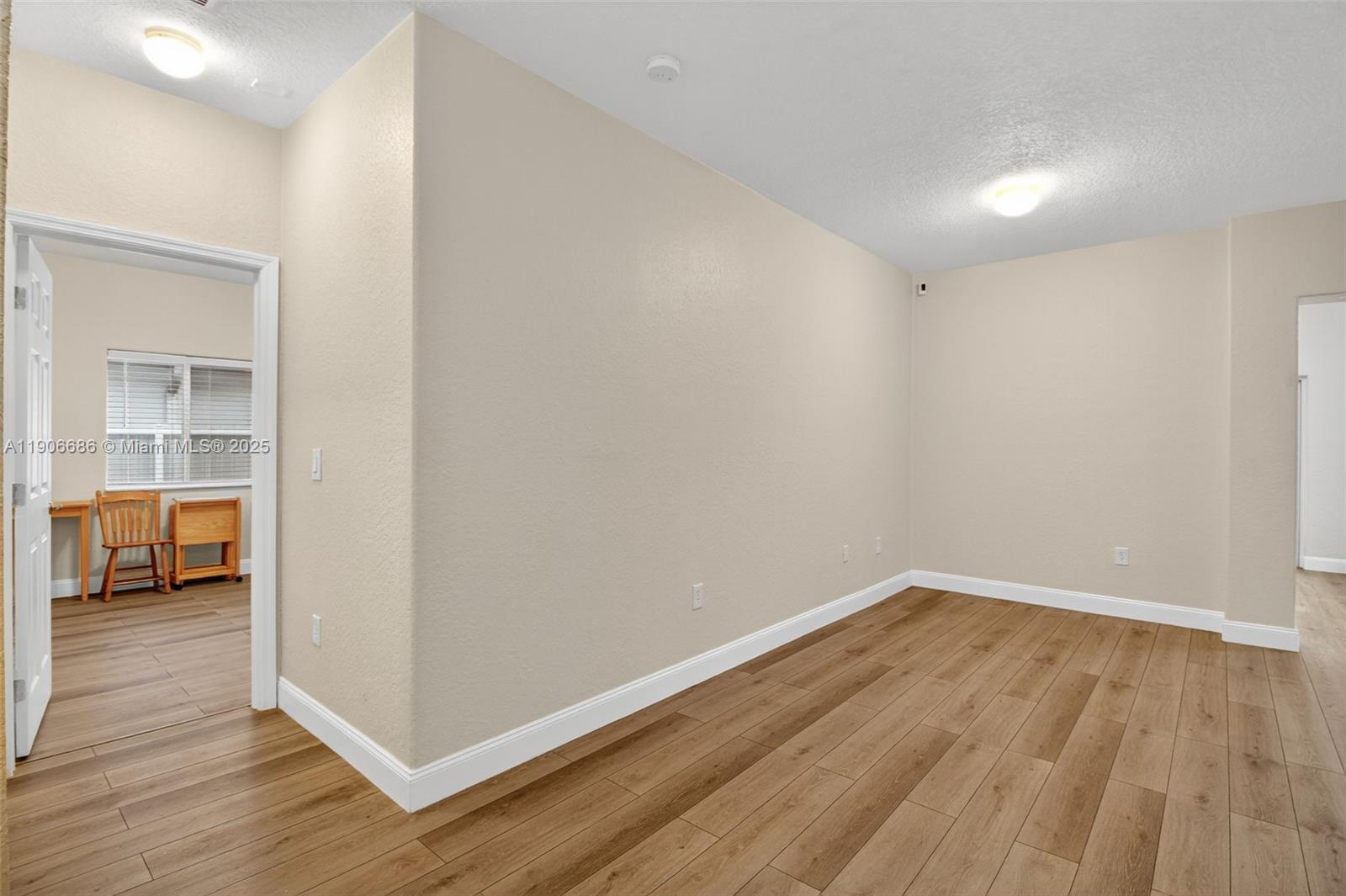 5302 Southwest 164th Place Miami, FL 33185 - Photo 29 of 43 a view of hallway with wooden floor