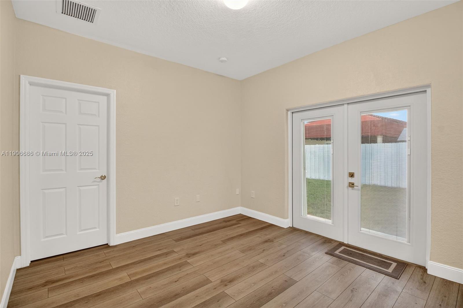 5302 Southwest 164th Place Miami, FL 33185 - Photo 30 of 43 wooden floor in an empty room