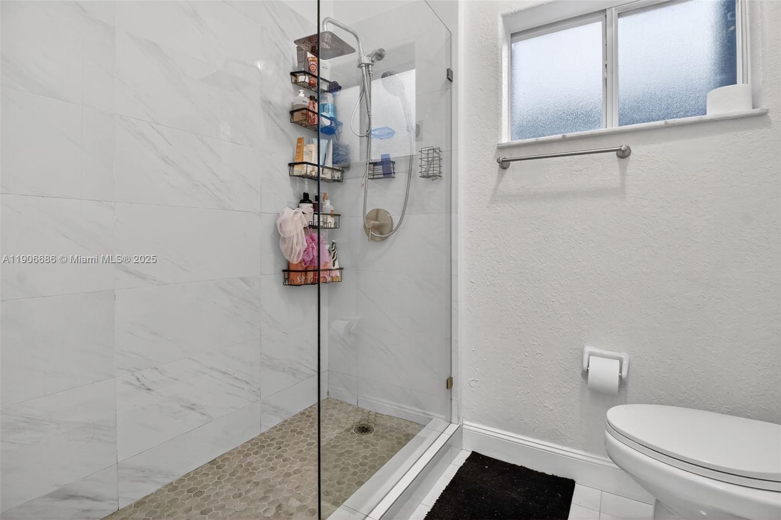 5302 Southwest 164th Place Miami, FL 33185 - Photo 34 of 43 a bathroom with a shower and toilet