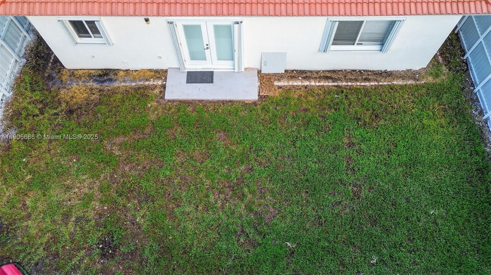 5302 Southwest 164th Place Miami, FL 33185 - Photo 38 of 43 a view of a back yard with a is wooden floor