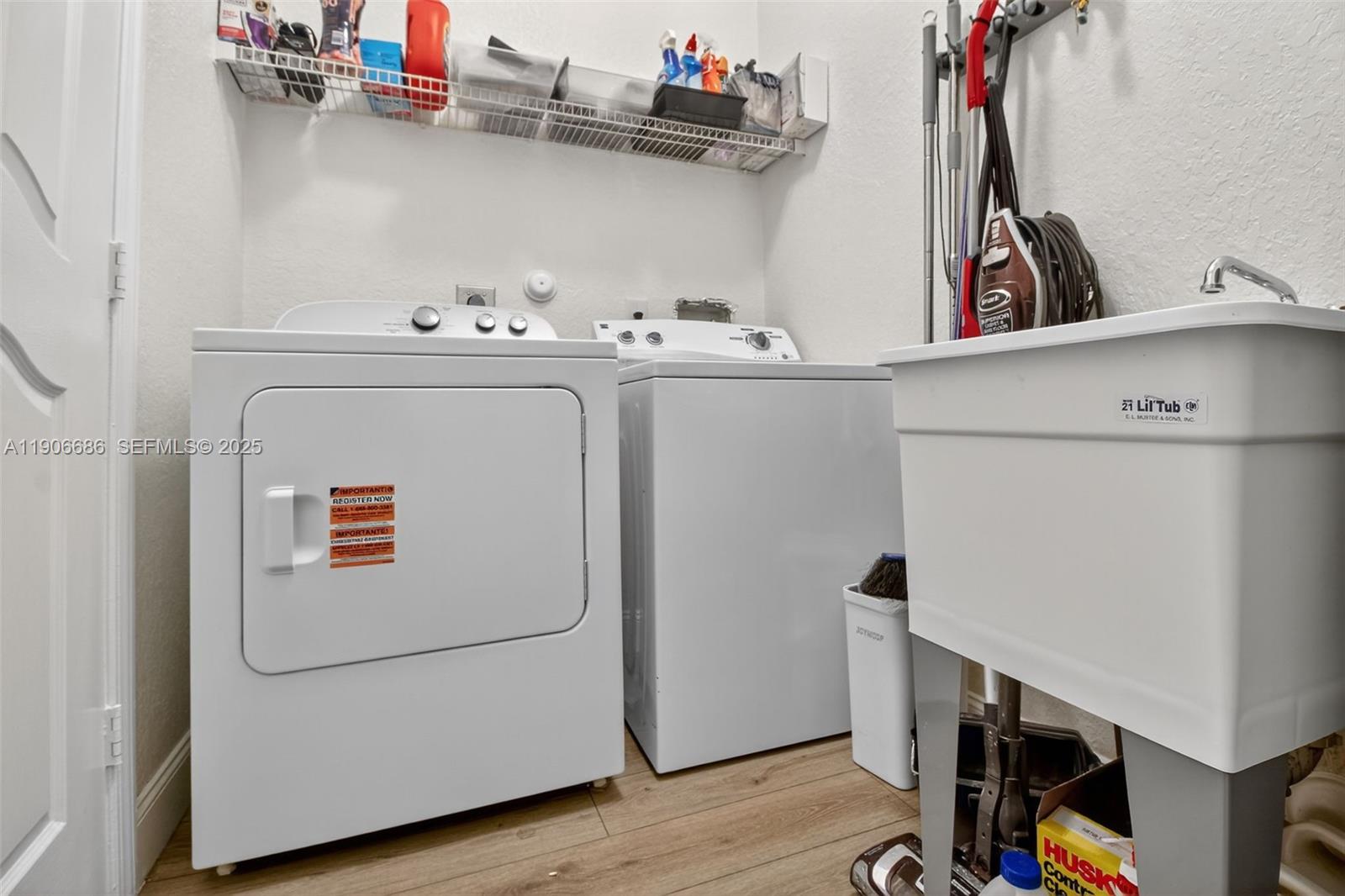 5302 Southwest 164th Place Miami, FL 33185 - Photo 42 of 43 a utility room with dryer and washer