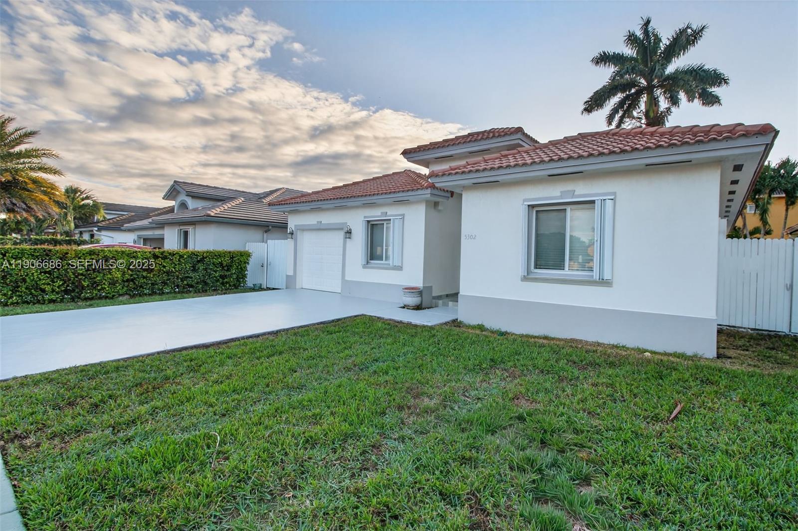 5302 Southwest 164th Place Miami, FL 33185 - Photo 5 of 43 a view of an house with backyard space and balcony