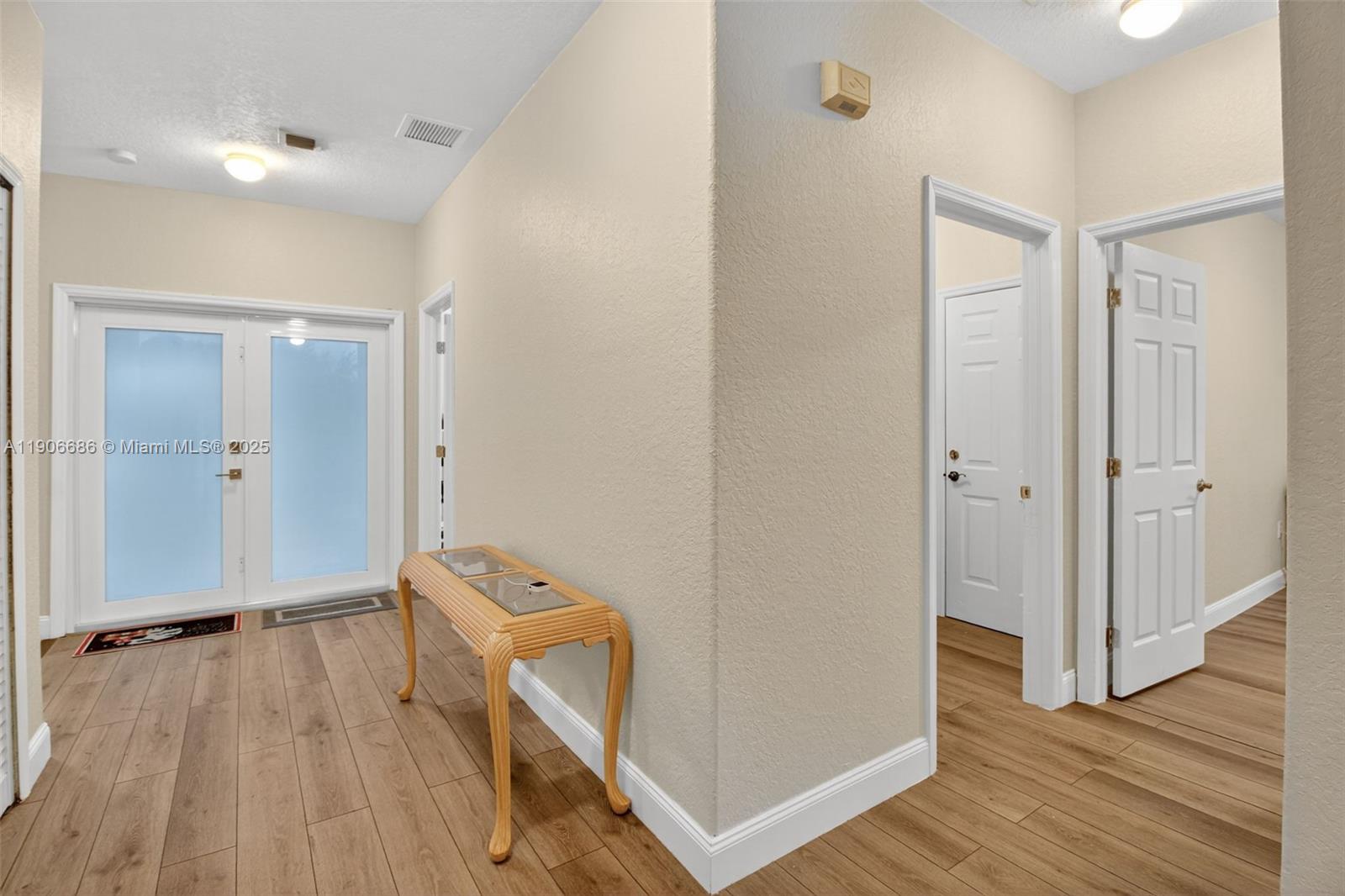 5302 Southwest 164th Place Miami, FL 33185 - Photo 8 of 43 a view of a room with wooden floor and a sink