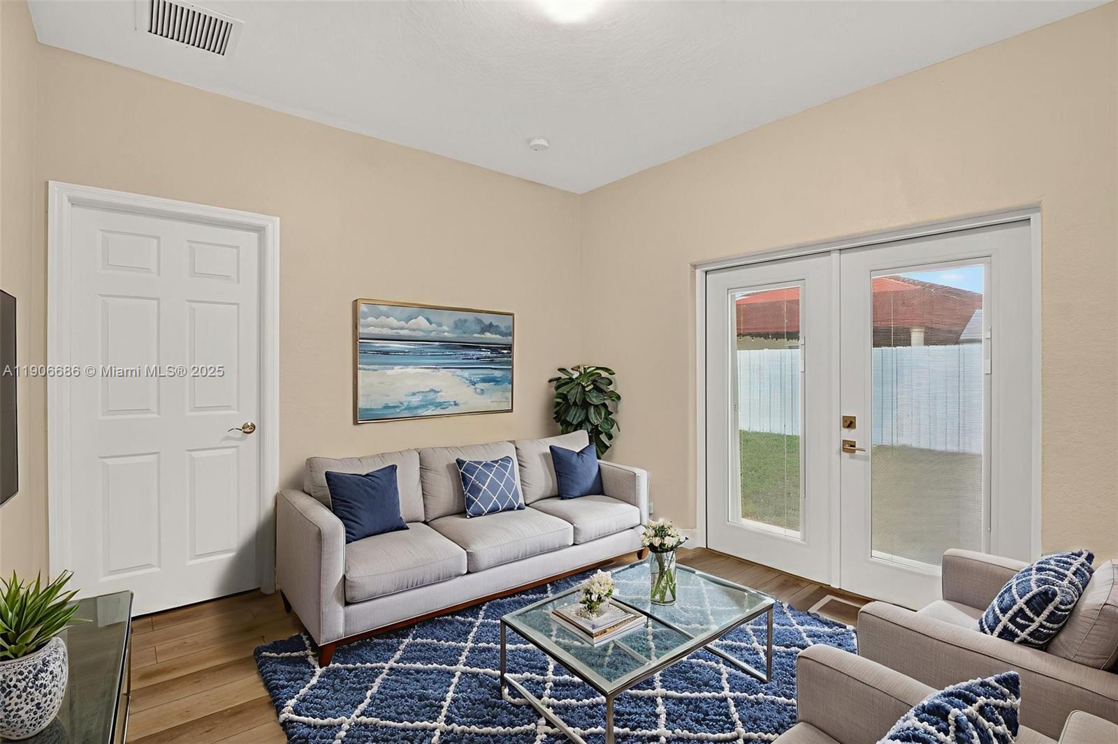 5302 Southwest 164th Place Miami, FL 33185 - Photo 9 of 43 a living room with furniture and a window