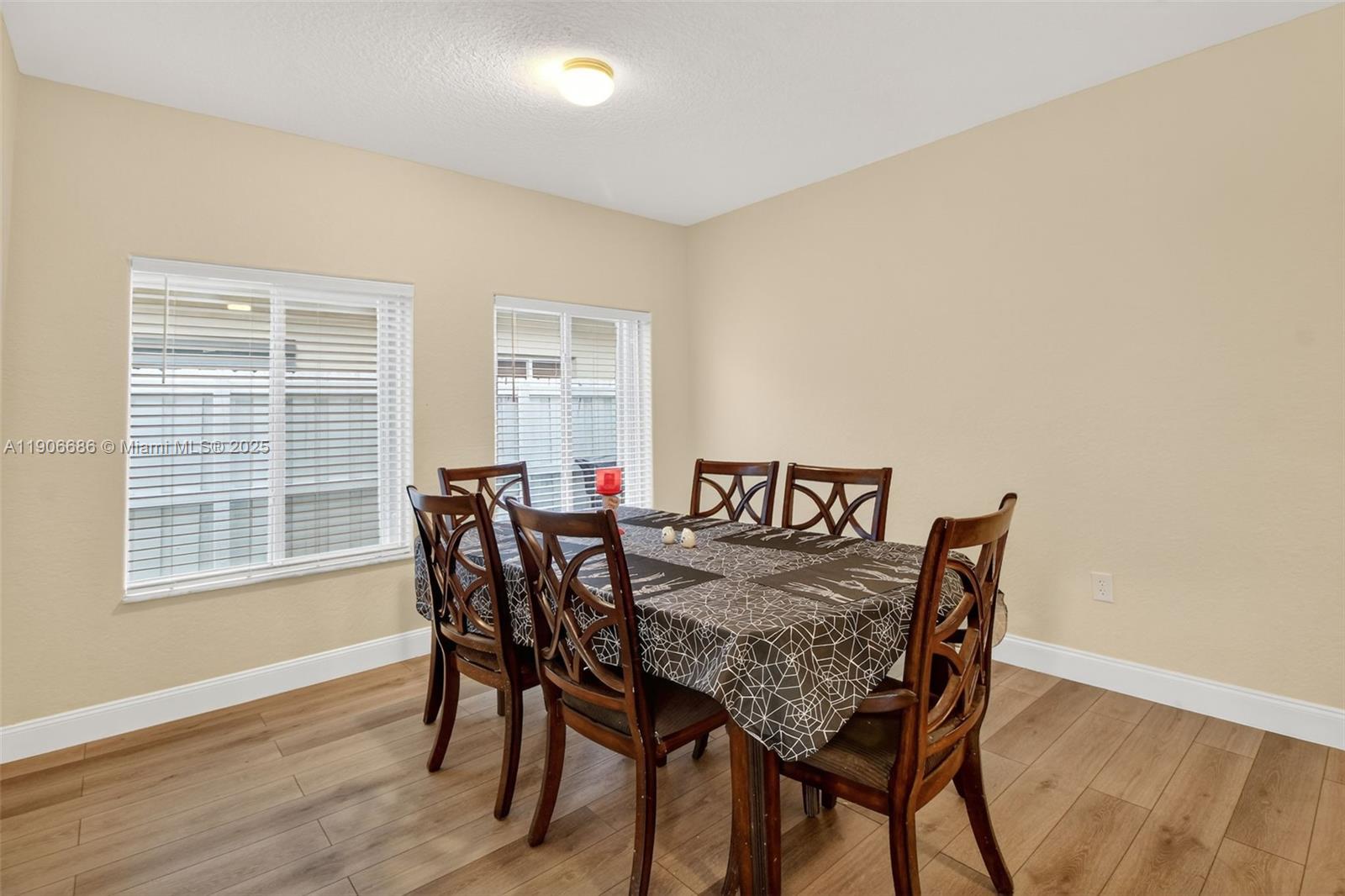 5302 Southwest 164th Place Miami, FL 33185 - Photo 10 of 43 a view of a dining room with furniture and wooden floor