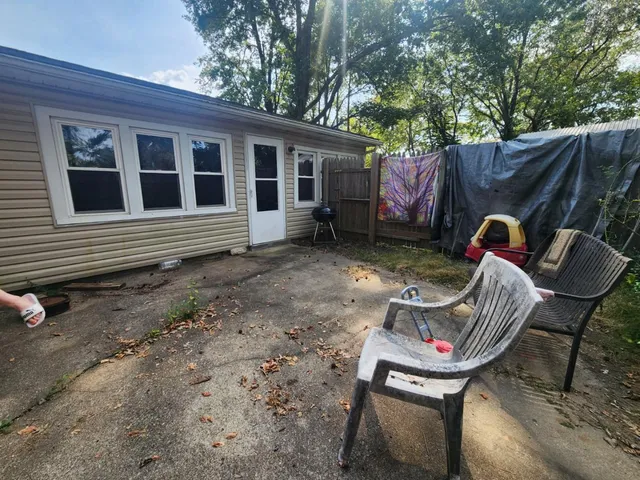 a backyard of a house with seating space