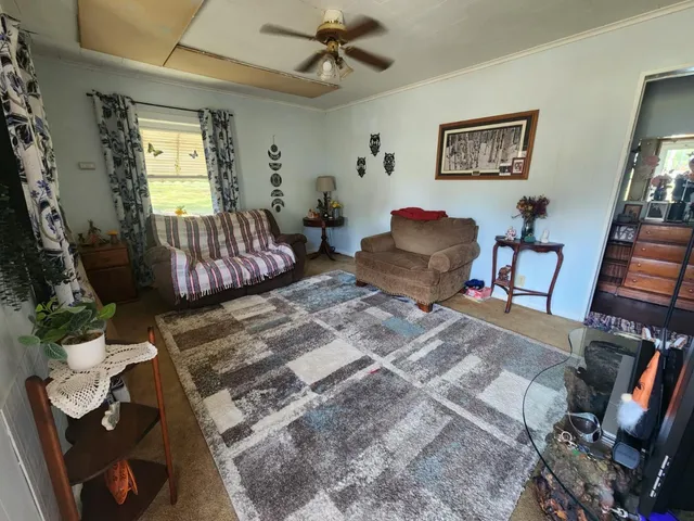 a bedroom with furniture and a window