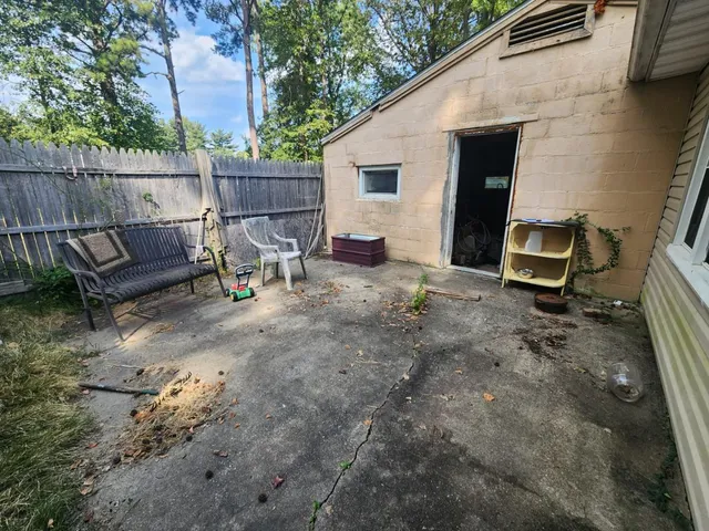 a view of a backyard with sitting area and furniture