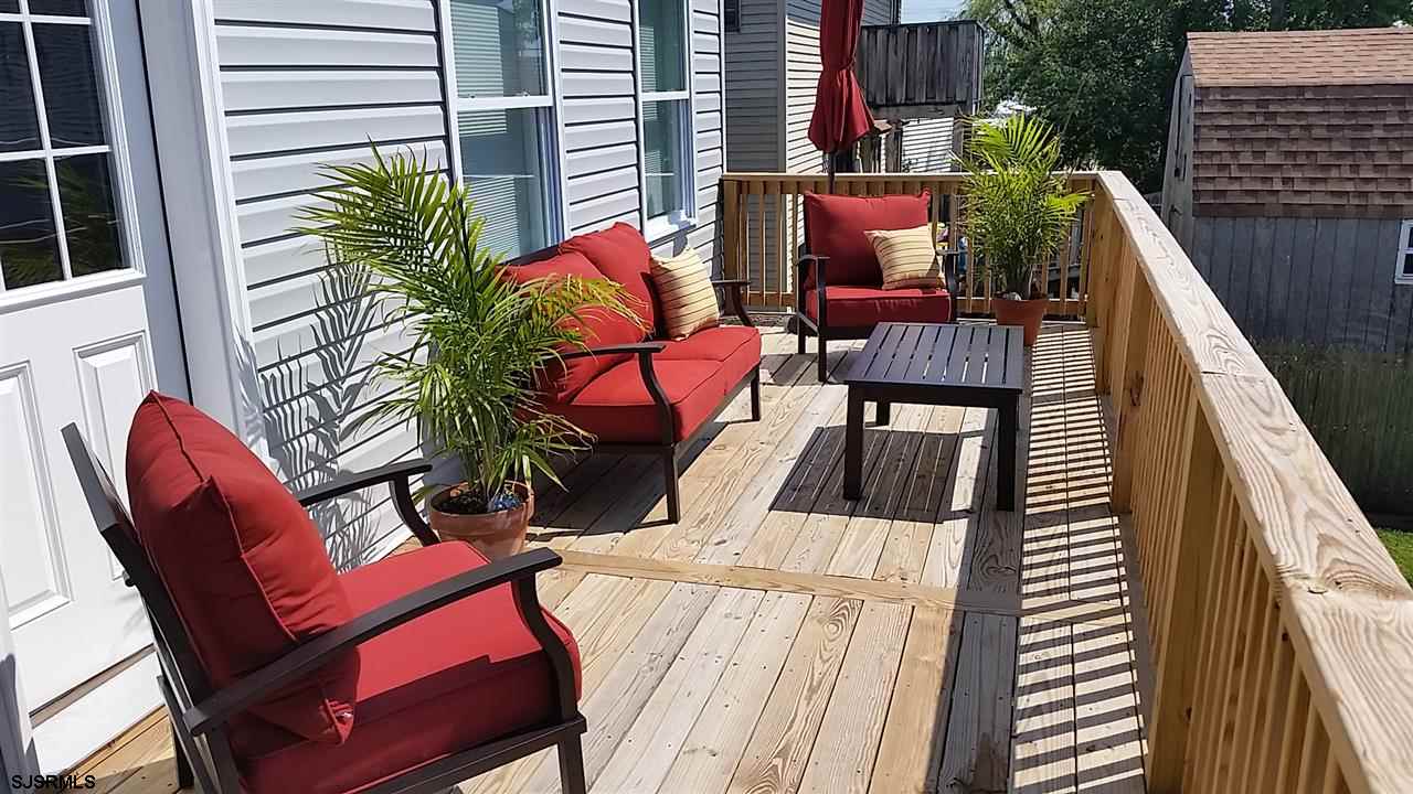 438 Hackney Place Brigantine, NJ 08203 - Photo 1 of 1 Large deck overlooking the private back yard. Ample space for seating, grill...