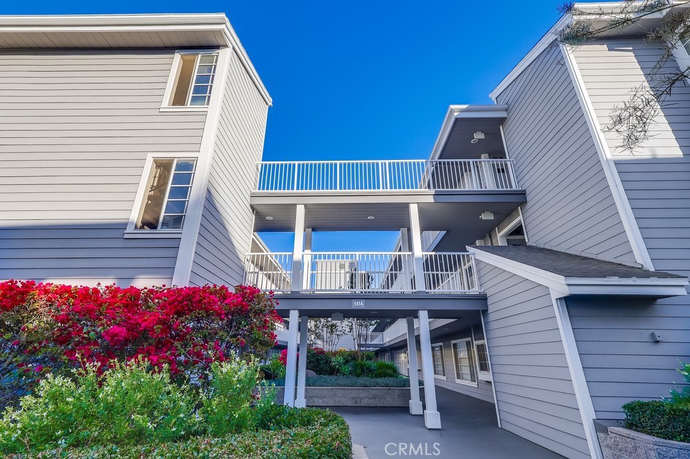 1414 Brett Place, Unit 128 San Pedro, CA 90732 - Photo 1 of 24 a front view of a house with a balcony
