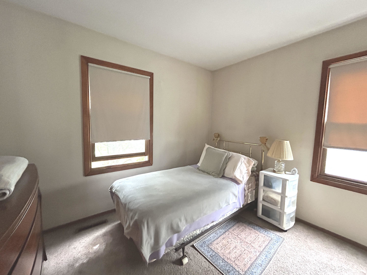328 Raupp Boulevard Buffalo Grove, IL 60089 - Photo 11 of 22 a bedroom with a bed and windows