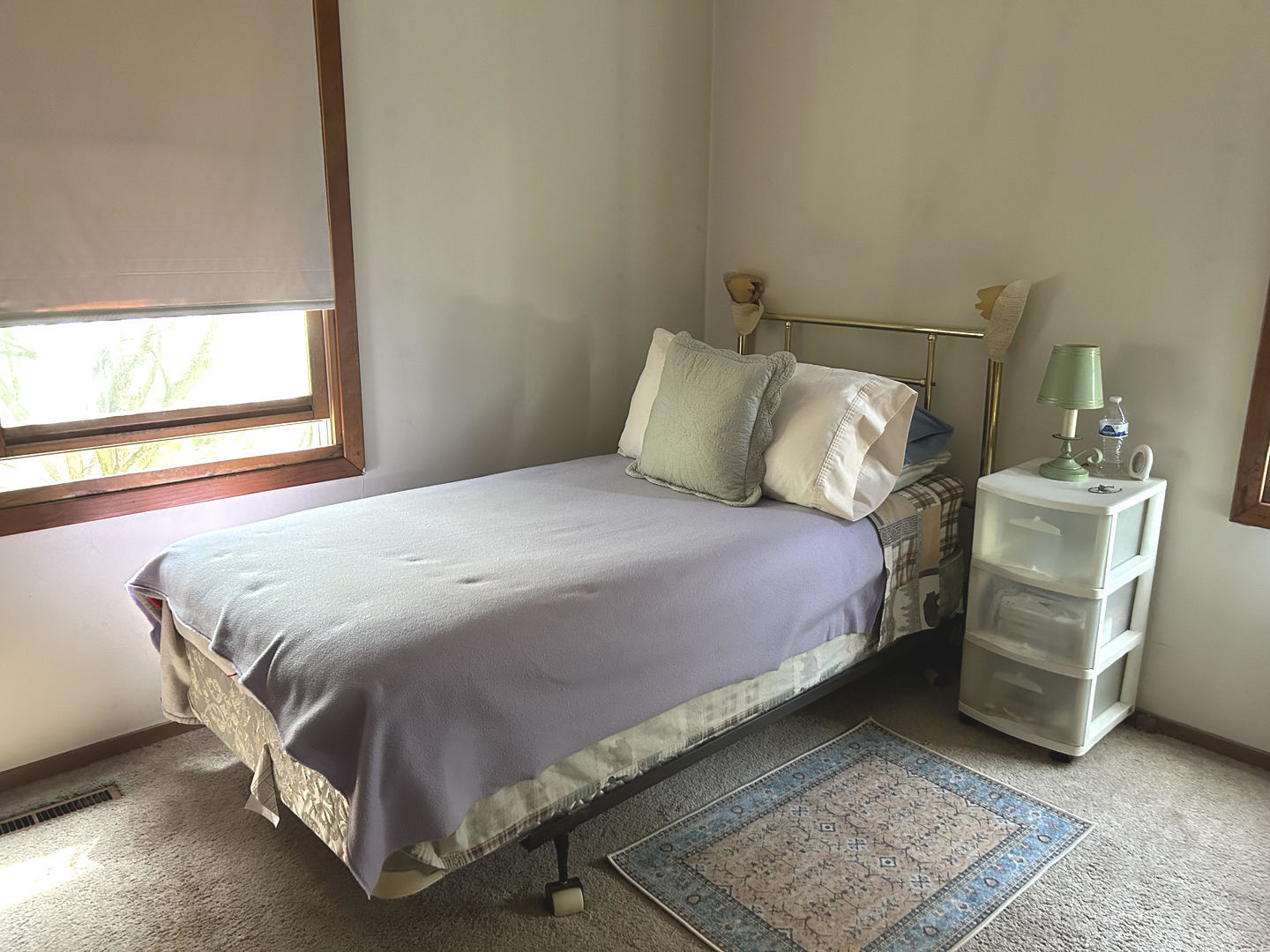 328 Raupp Boulevard Buffalo Grove, IL 60089 - Photo 12 of 22 a bedroom with a bed and a chair