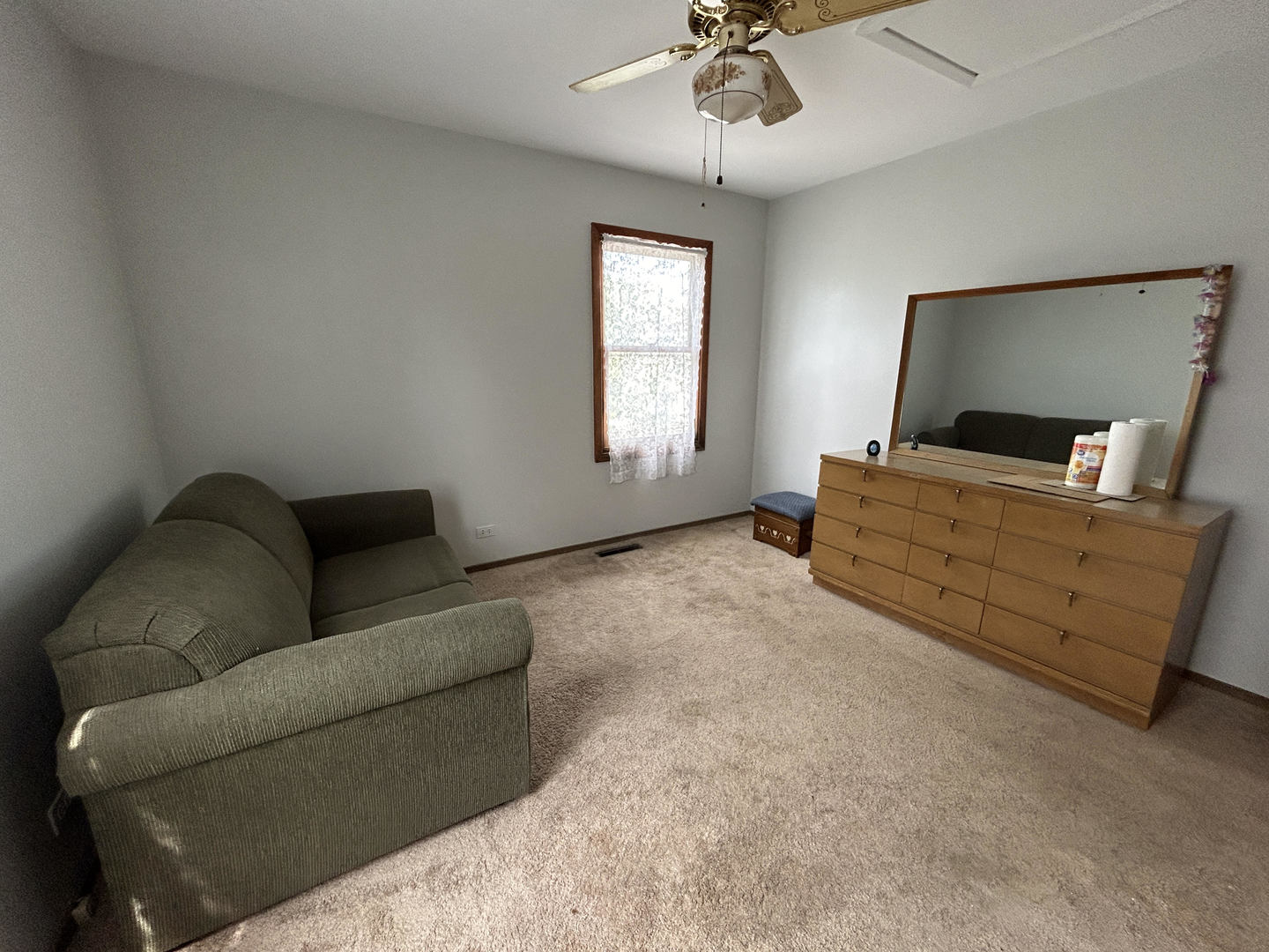 328 Raupp Boulevard Buffalo Grove, IL 60089 - Photo 9 of 22 a living room with furniture and a flat screen tv