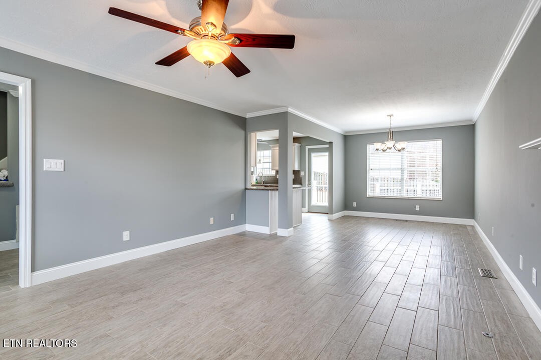 1296 Emerald Forest Lane Powell, TN 37849 - Photo 13 of 43 wooden floor in an empty room with a window