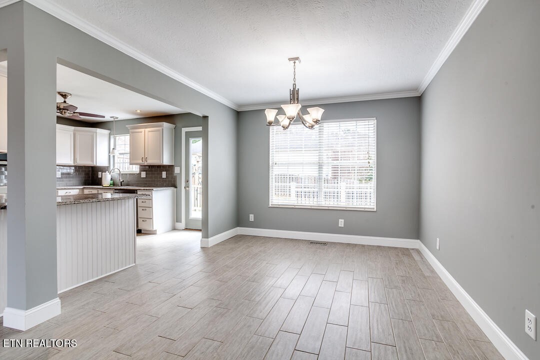 1296 Emerald Forest Lane Powell, TN 37849 - Photo 14 of 43 a view of kitchen with granite countertop cabinets and refrigerator