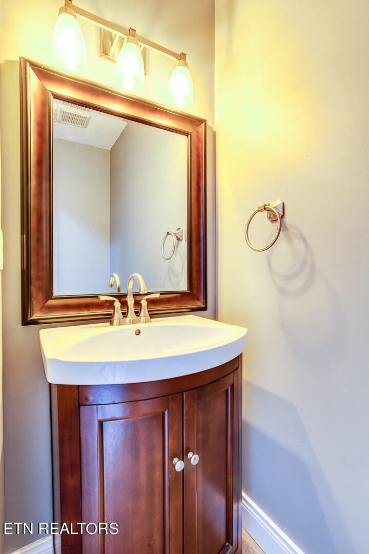 1296 Emerald Forest Lane Powell, TN 37849 - Photo 21 of 43 a bathroom with a sink and a mirror