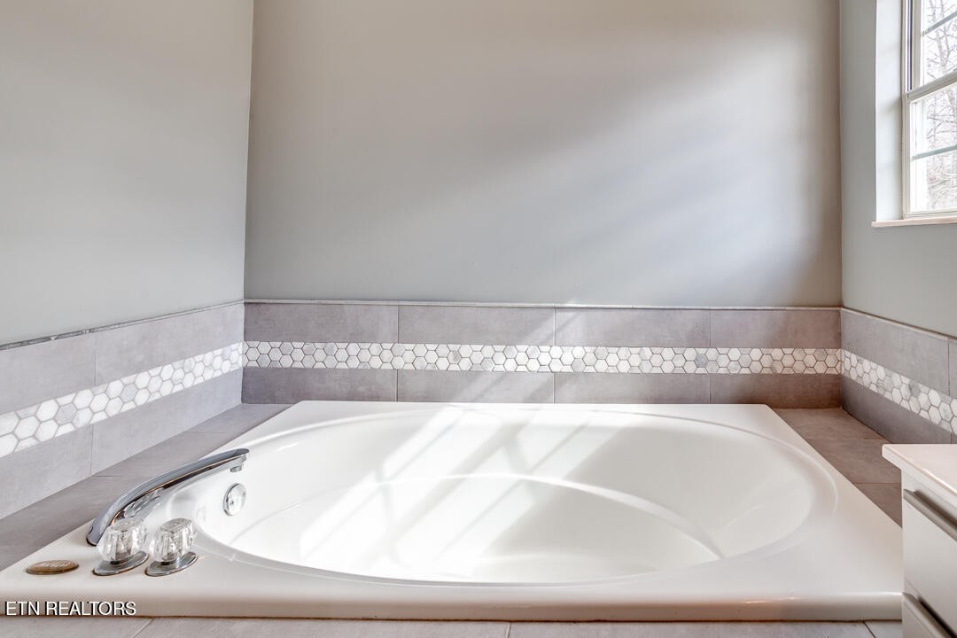 1296 Emerald Forest Lane Powell, TN 37849 - Photo 27 of 43 a bathroom with a bathtub