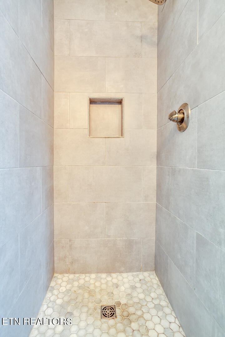 1296 Emerald Forest Lane Powell, TN 37849 - Photo 28 of 43 a bathroom with a shower